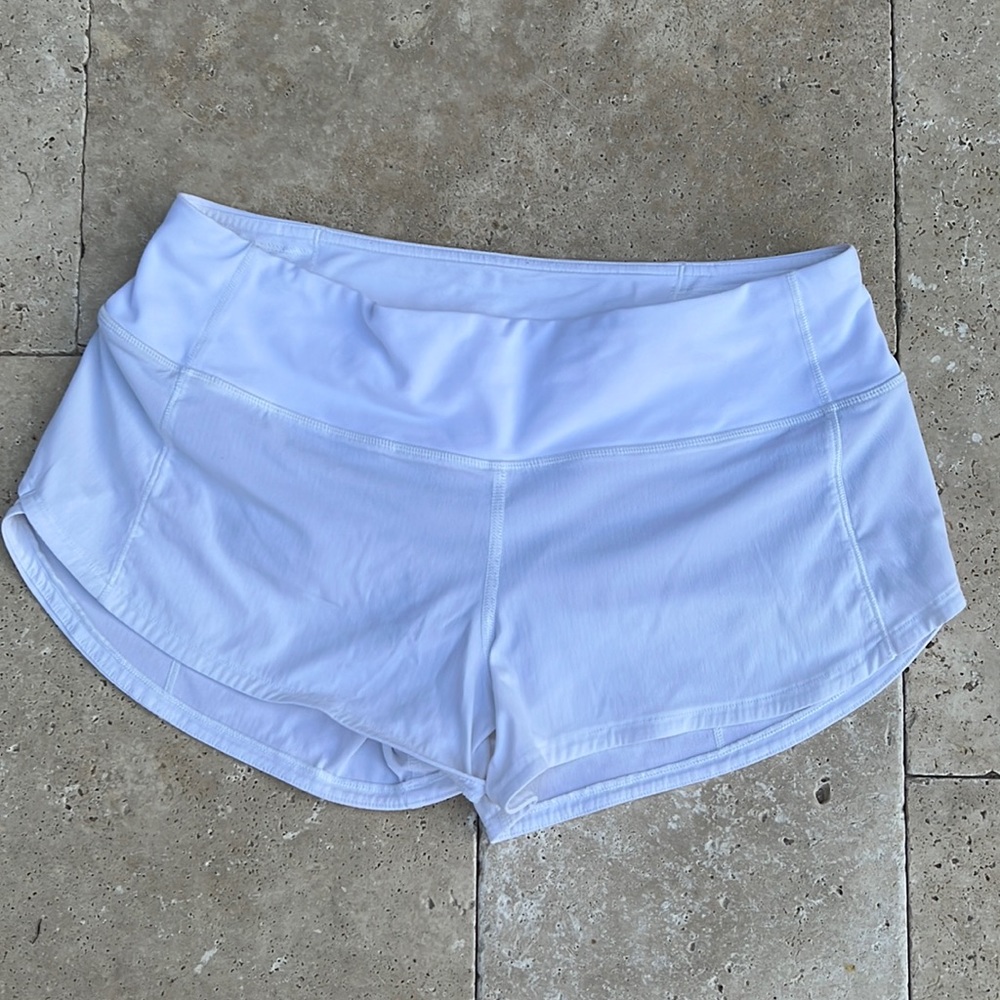 White Lululemon shorts size 4 regular. 2.5 inch length.